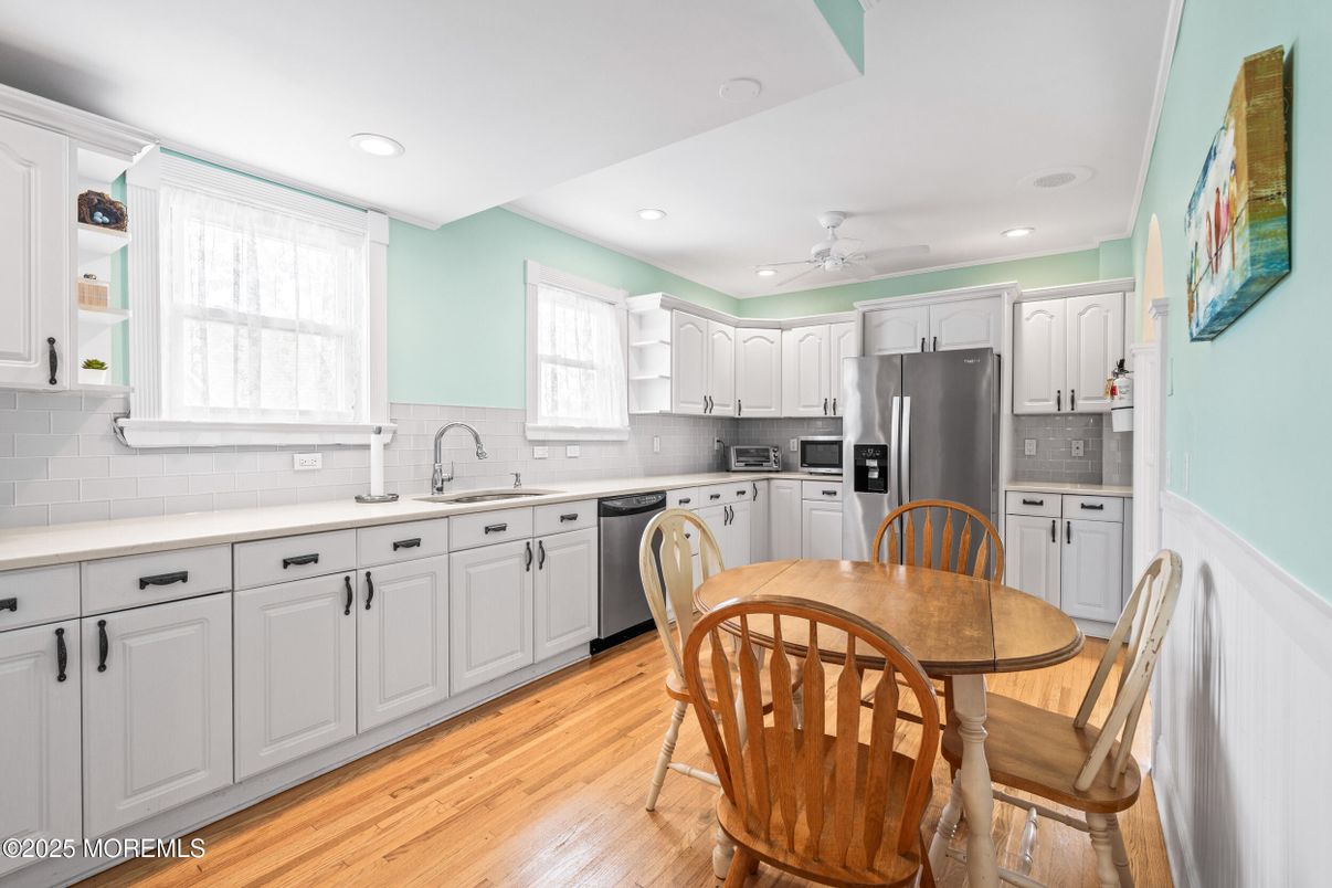 Dining room, Interior, Kitchen, Recessed Lighting, Stainless Steel Appliances, Wood Texture Flooring