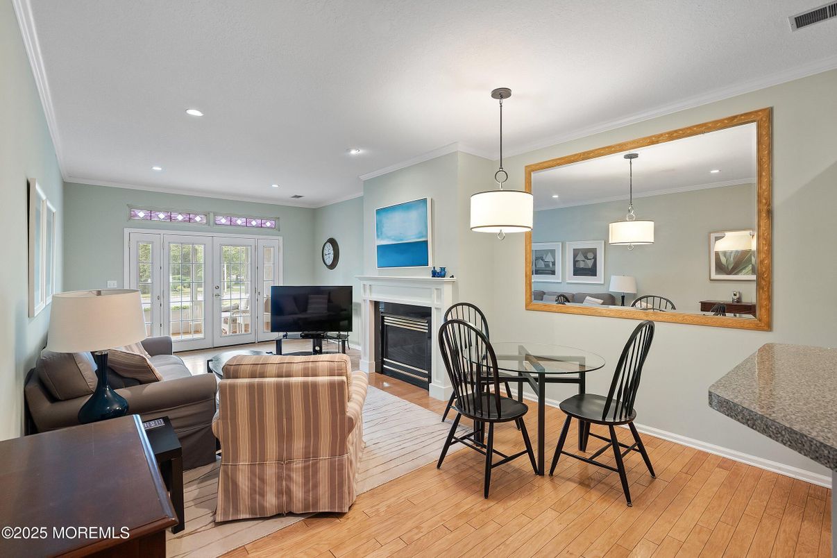 Dining room, Fireplace, Interior, Living room, Pendant Lights, Recessed Lighting, Wood Texture Flooring