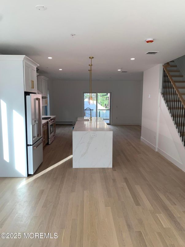 Interior, Kitchen, Pendant Lights, Recessed Lighting, Stainless Steel Appliances, Wood Texture Flooring