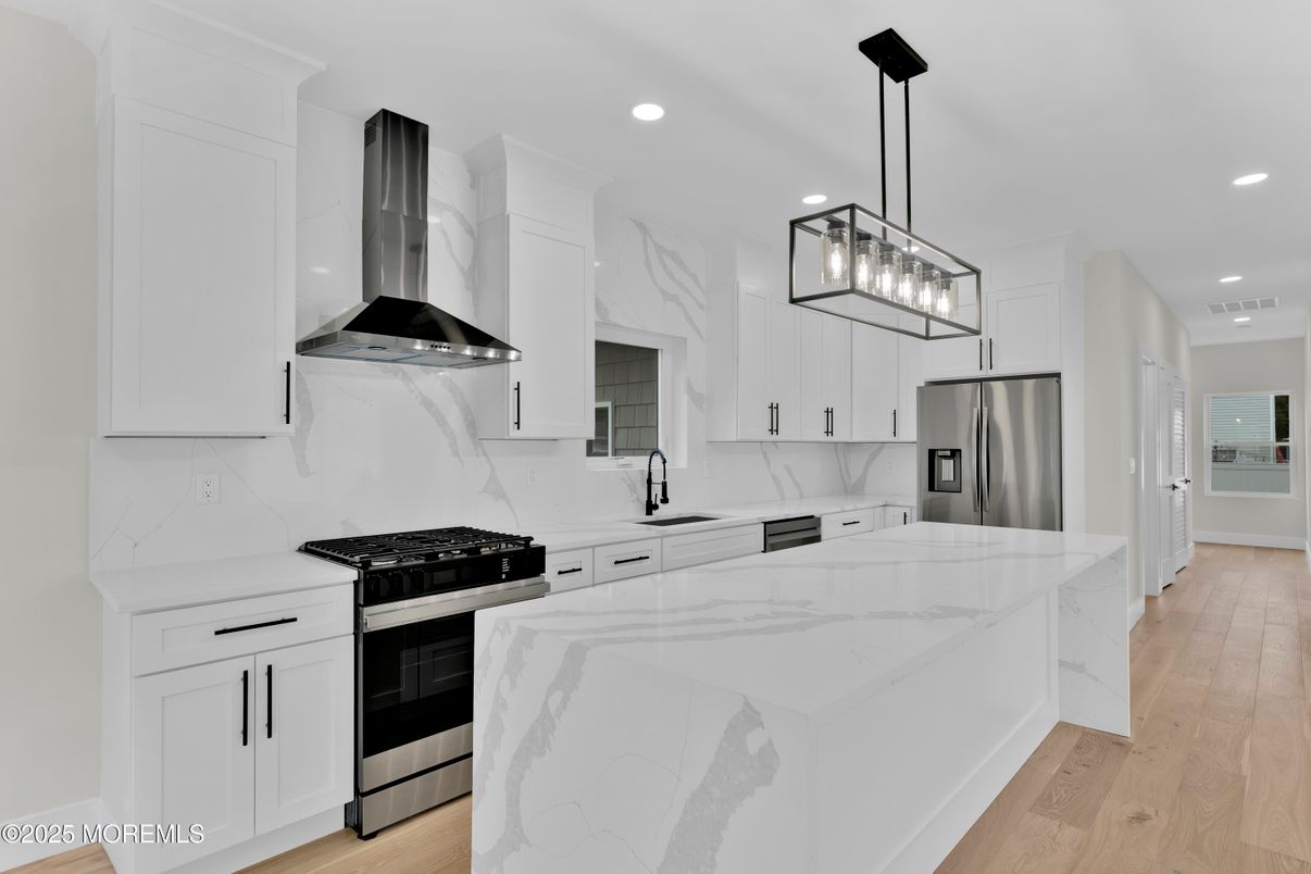 Interior, Kitchen, Marble Walls, Pendant Lights, Recessed Lighting, Stainless Steel Appliances, Wood Texture Flooring
