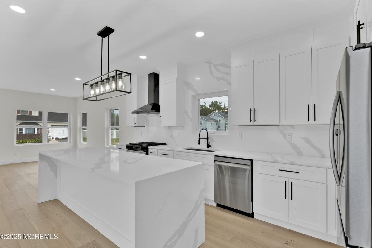 Interior, Kitchen, Marble Walls, Pendant Lights, Recessed Lighting, Stainless Steel Appliances, Wood Texture Flooring