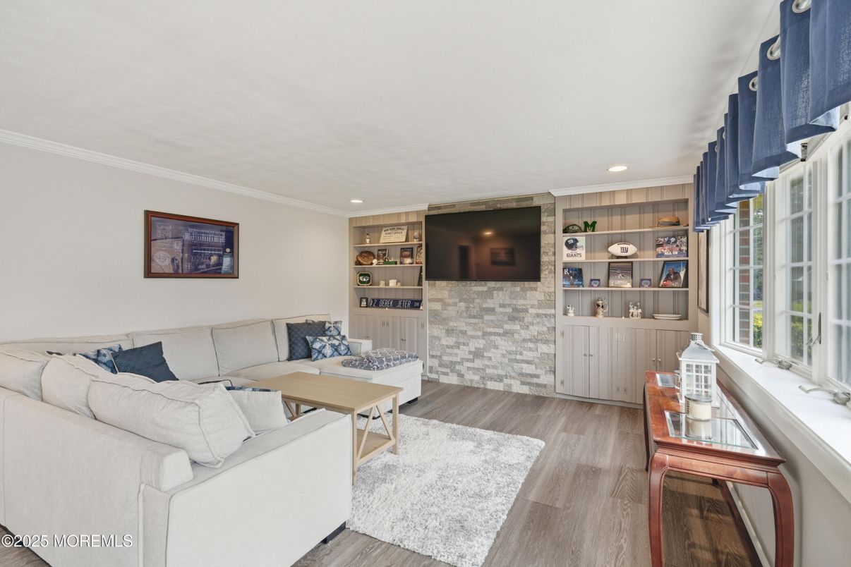 Fireplace, Interior, Living room, Recessed Lighting, Stone Walls, Wood Texture Flooring