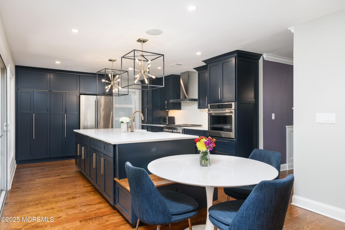 Dining room, Interior, Kitchen, Pendant Lights, Recessed Lighting, Stainless Steel Appliances, Wood Texture Flooring