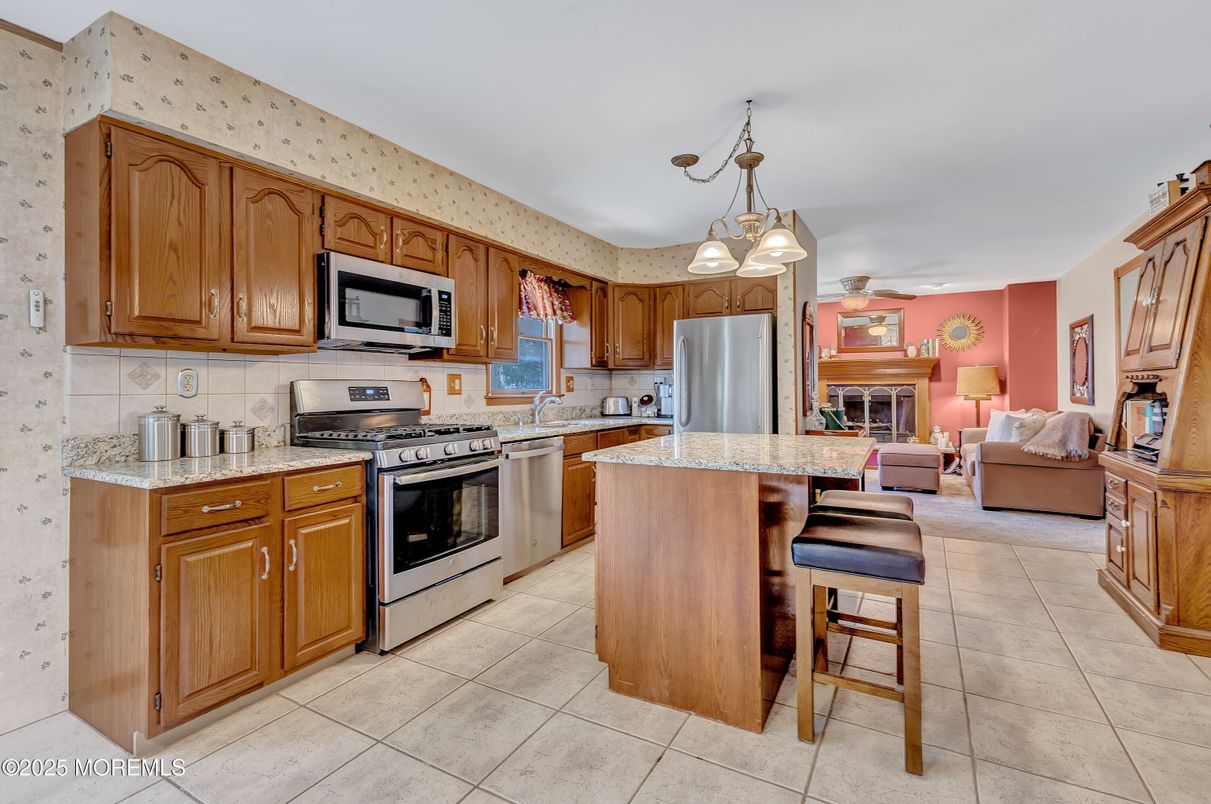 Fireplace, Interior, Kitchen, Living room, Pendant Lights, Stainless Steel Appliances