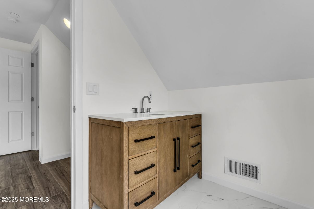 Bathroom, Dual Sink Vanities, Interior, Marble, Recessed Lighting, Wood Texture Flooring