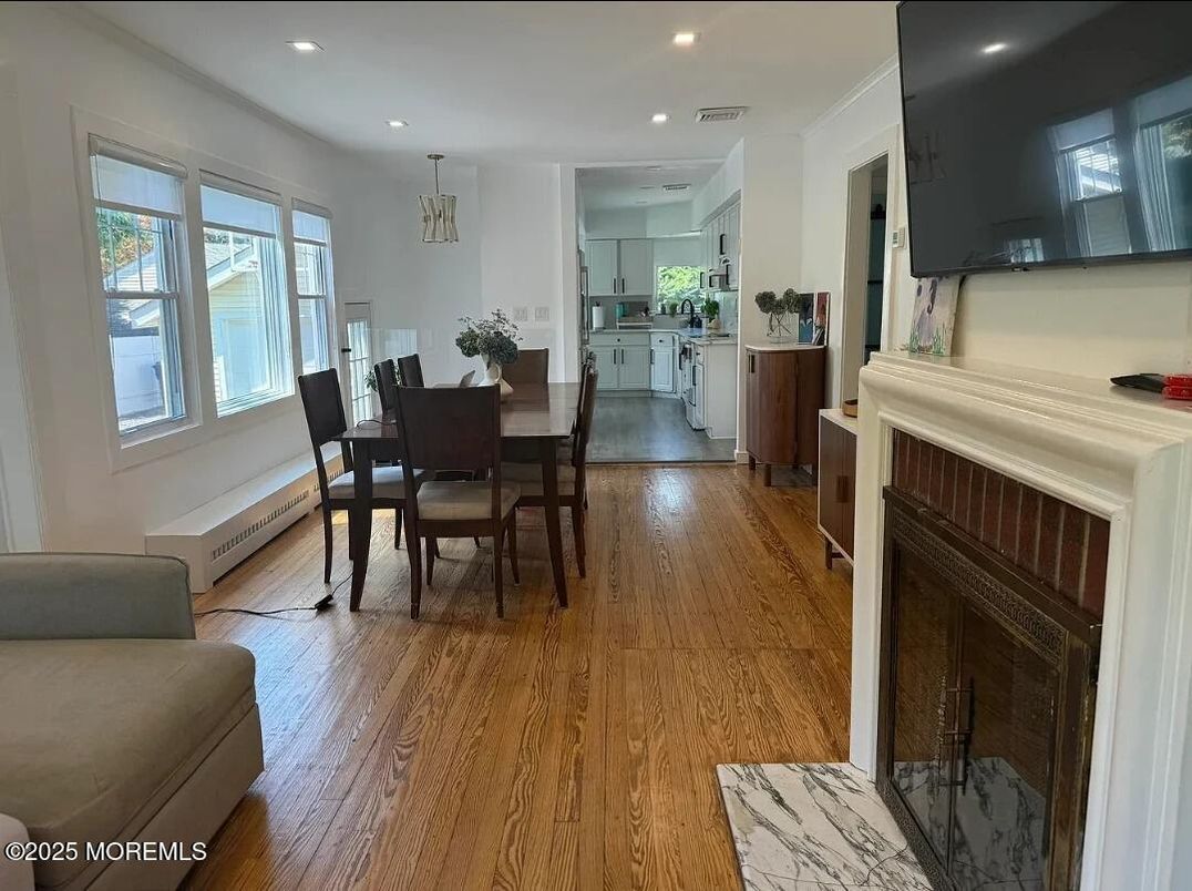 Dining room, Fireplace, Interior, Kitchen, Pendant Lights, Recessed Lighting, Wood Texture Flooring