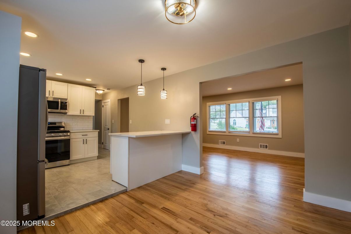 Interior, Kitchen, Pendant Lights, Recessed Lighting, Stainless Steel Appliances, Wood Texture Flooring