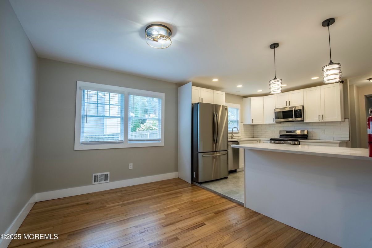 Interior, Kitchen, Pendant Lights, Recessed Lighting, Stainless Steel Appliances, Wood Texture Flooring