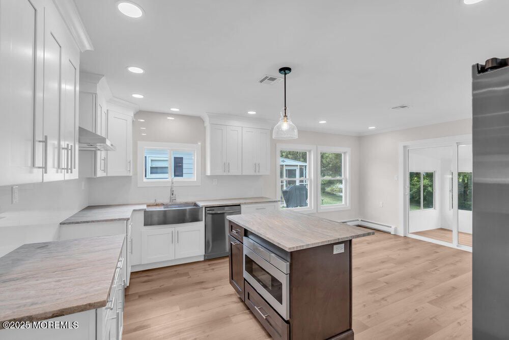Interior, Kitchen, Pendant Lights, Recessed Lighting, Stainless Steel Appliances, Wood Texture Flooring