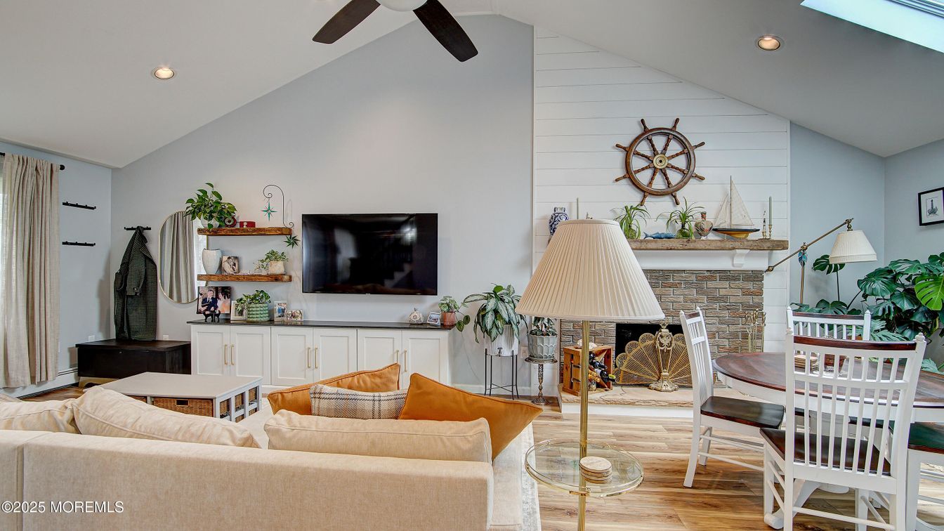 Dining room, Fireplace, Interior, Living room, Recessed Lighting, Wood Texture Flooring