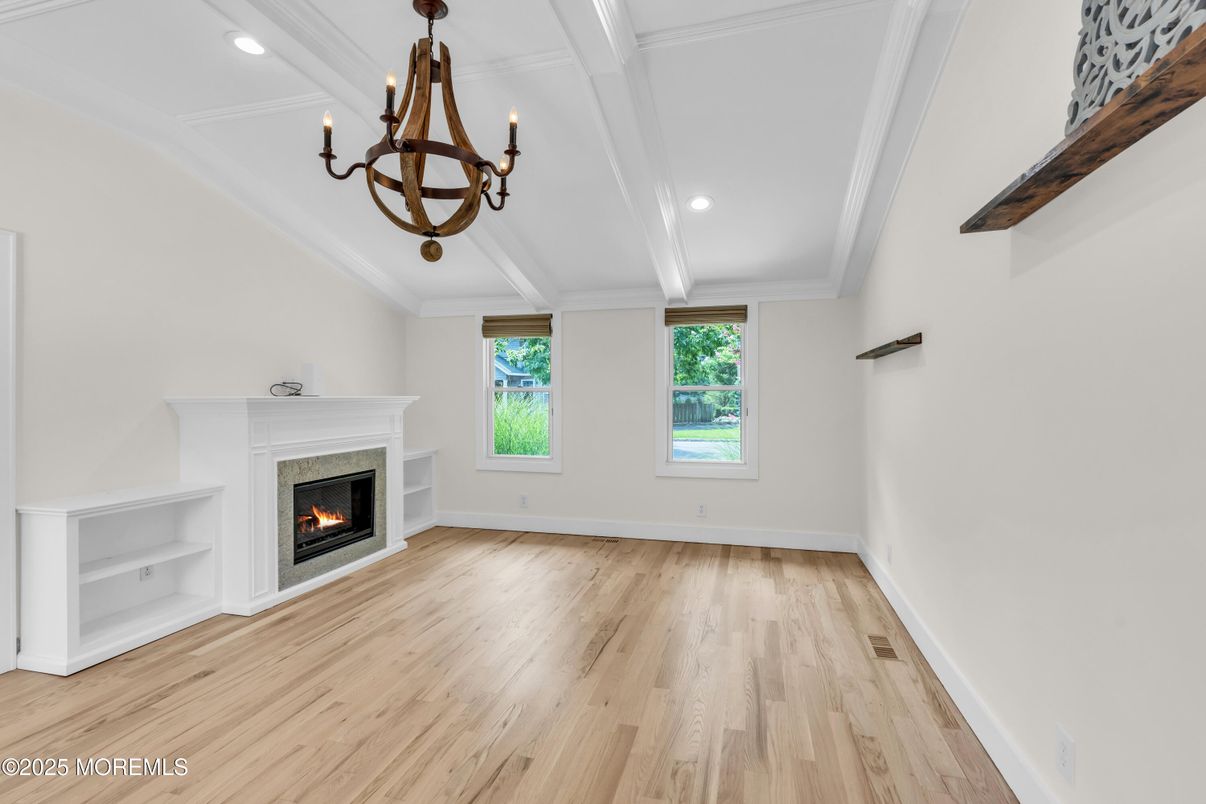 Chandelier, Empty room, Fireplace, Interior, Recessed Lighting, Wood Texture Flooring