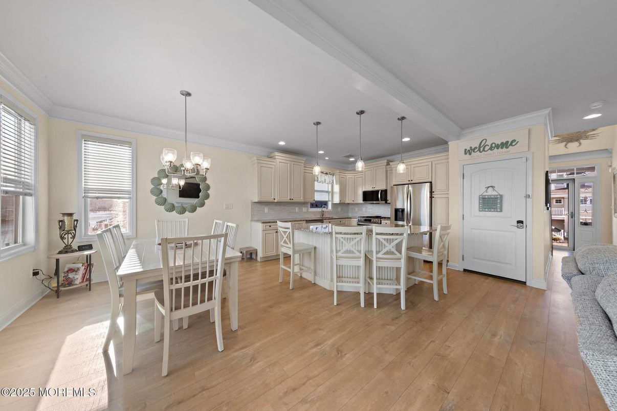 Chandelier, Dining room, Interior, Kitchen, Pendant Lights, Recessed Lighting, Stainless Steel Appliances, Wood Texture Flooring