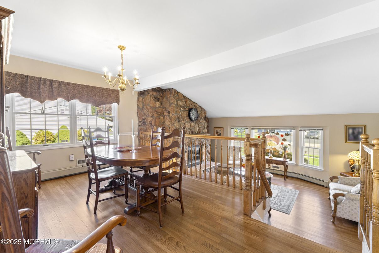 Chandelier, Dining room, Fireplace, Interior, Stone Walls, Wood Texture Flooring
