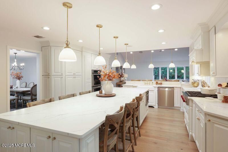 Chandelier, Dining room, Interior, Kitchen, Pendant Lights, Recessed Lighting, Stainless Steel Appliances, Wood Texture Flooring