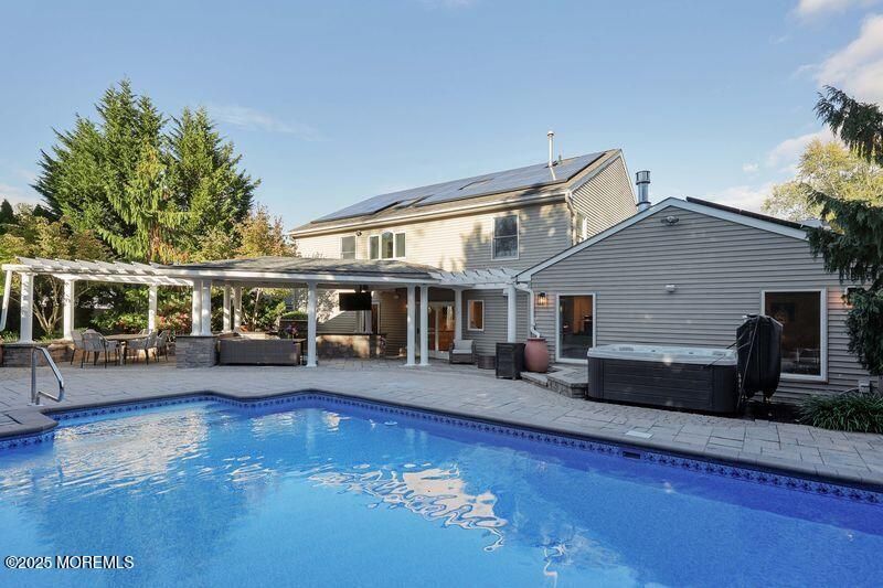 Exterior, Pool, Solar Panels