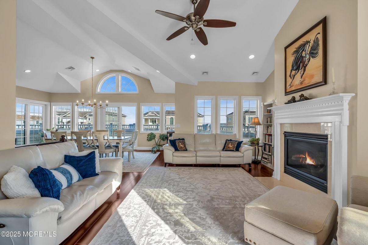 Chandelier, Dining room, Fireplace, Interior, Living room, Pendant Lights, Recessed Lighting, Wood Texture Flooring