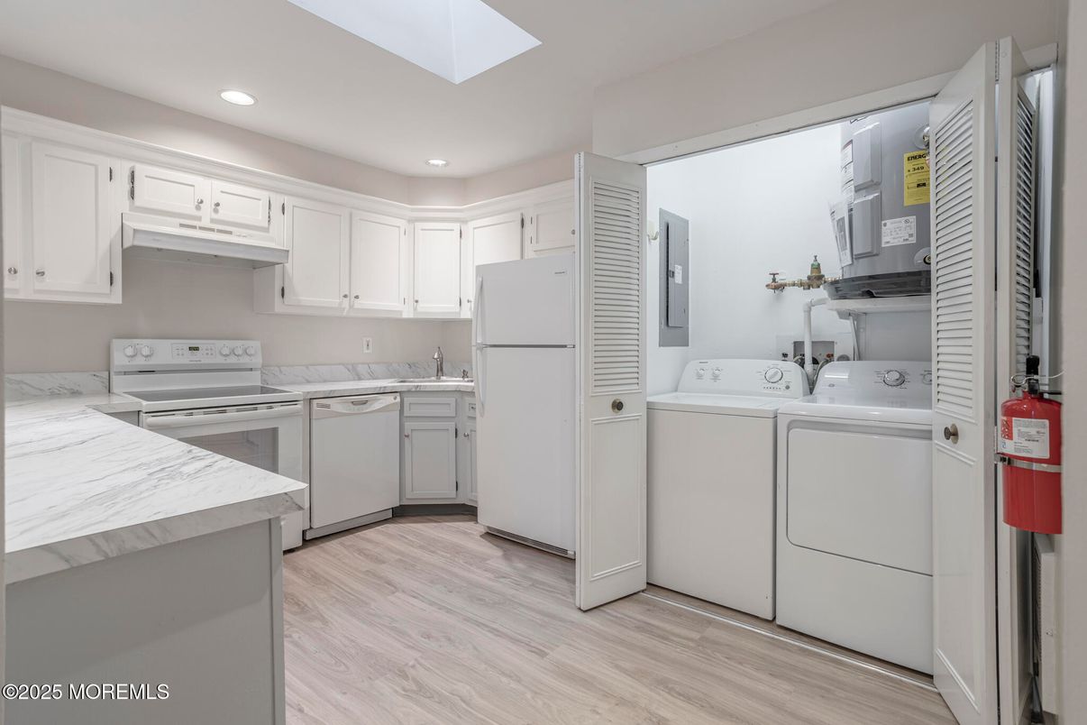 Interior, Kitchen, Recessed Lighting, Washer, Wood Texture Flooring