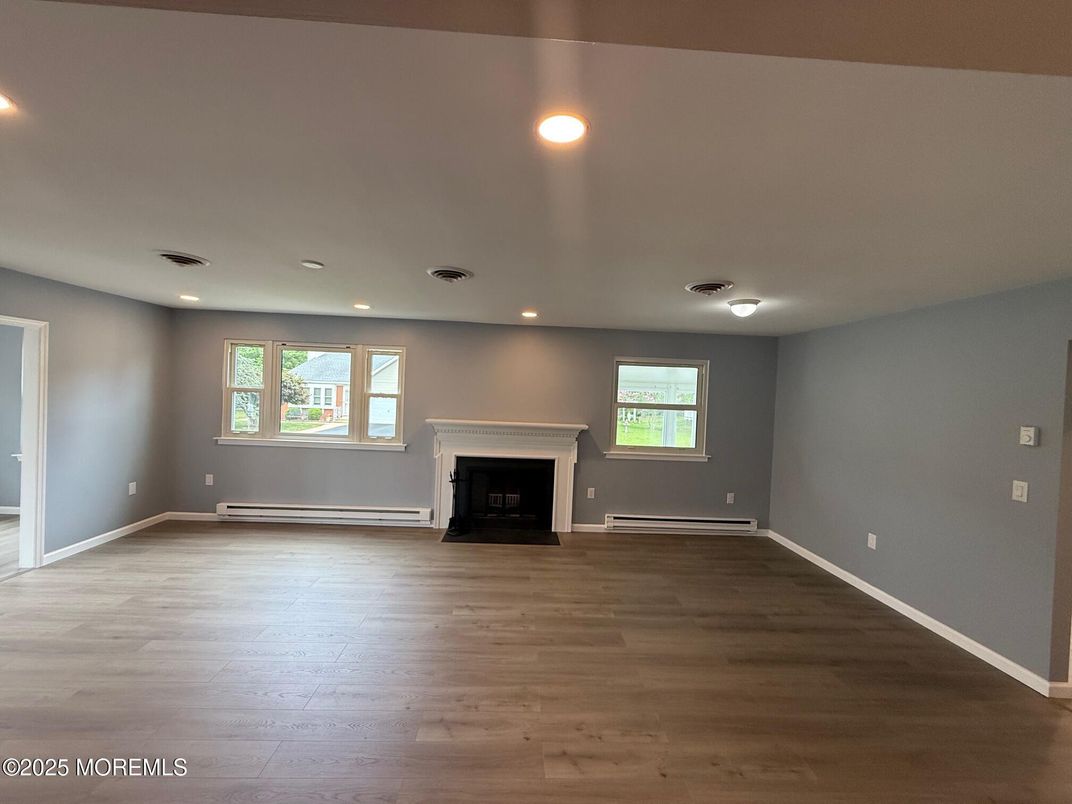 Empty room, Fireplace, Interior, Recessed Lighting, Wood Texture Flooring