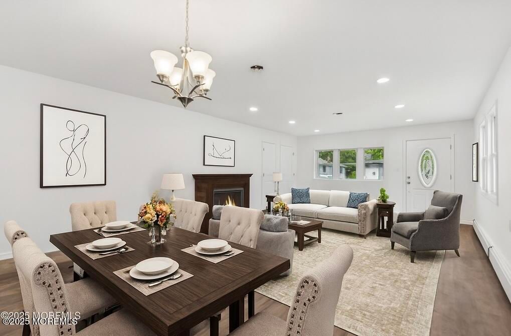 Chandelier, Dining room, Fireplace, Interior, Living room, Recessed Lighting, Wood Texture Flooring