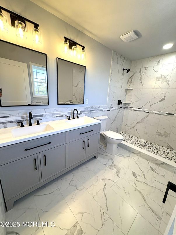 Bathroom, Dual Sink Vanities, Interior, Marble, Marble Walls, Recessed Lighting