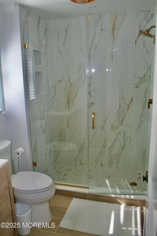 Bathroom, Glass Shower, Interior, Marble Walls, Wood Texture Flooring