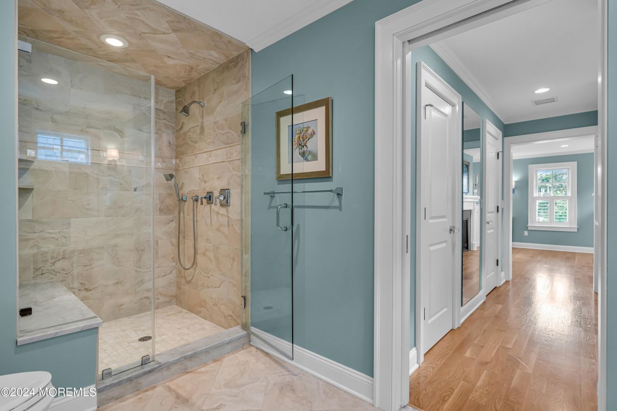 Bathroom, Glass Shower, Interior, Marble Walls, Recessed Lighting, Wood Texture Flooring