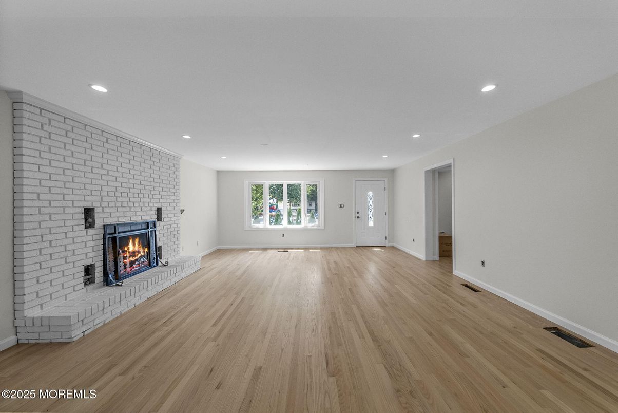 Empty room, Fireplace, Interior, Recessed Lighting, Stone Walls, Wood Texture Flooring