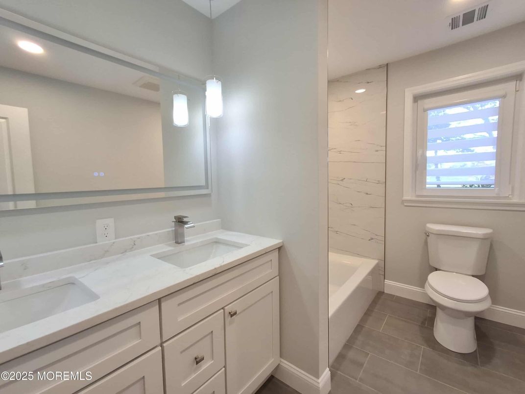 Bathroom, Dual Sink Vanities, Interior, Marble Walls, Recessed Lighting