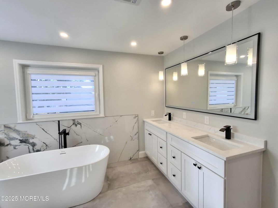 Bathroom, Dual Sink Vanities, Free Standing Baths, Interior, Marble Walls, Pendant Lights, Recessed Lighting