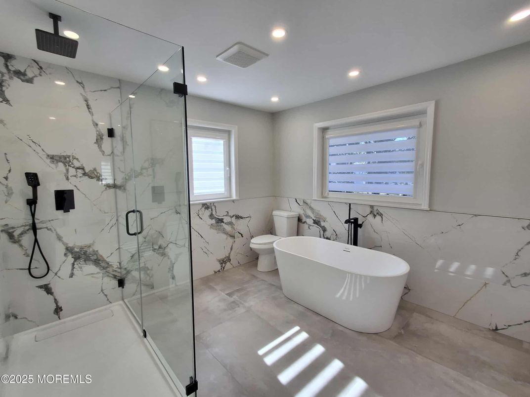 Bathroom, Free Standing Baths, Glass Shower, Interior, Marble Walls, Recessed Lighting