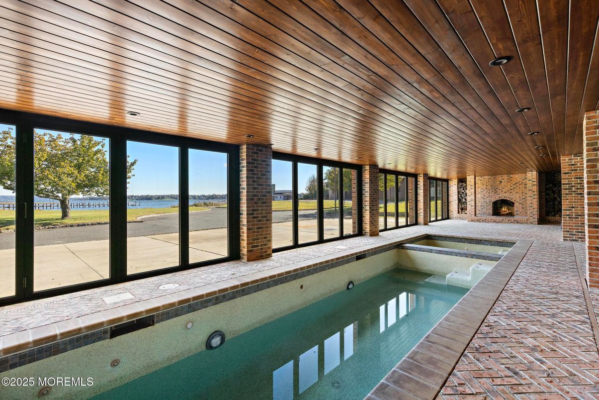 Fireplace, Interior, Pool, Stone Walls, Water, Wooden Ceilings