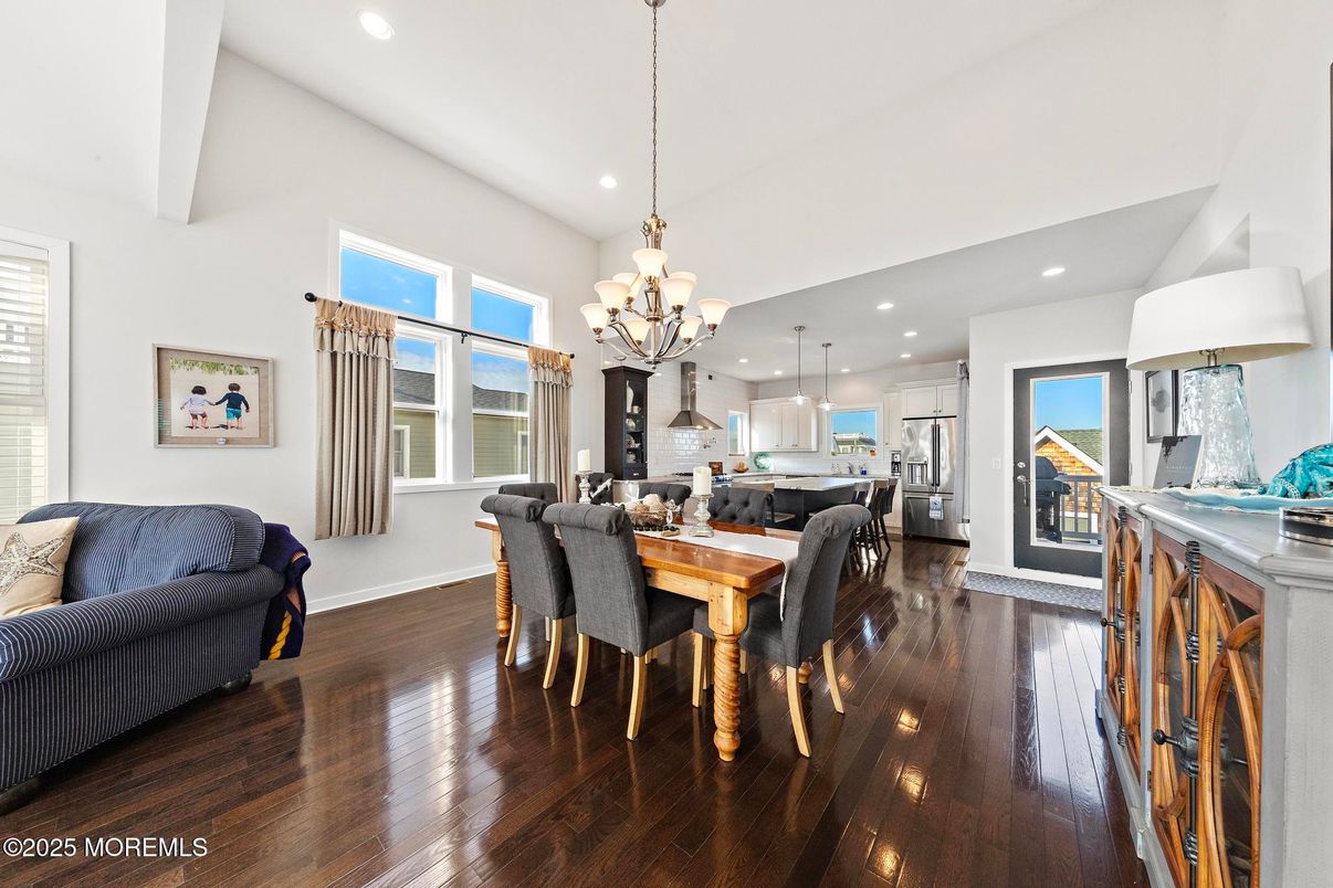 Chandelier, Dining room, Interior, Kitchen, Pendant Lights, Recessed Lighting, Stainless Steel Appliances, Wood Texture Flooring