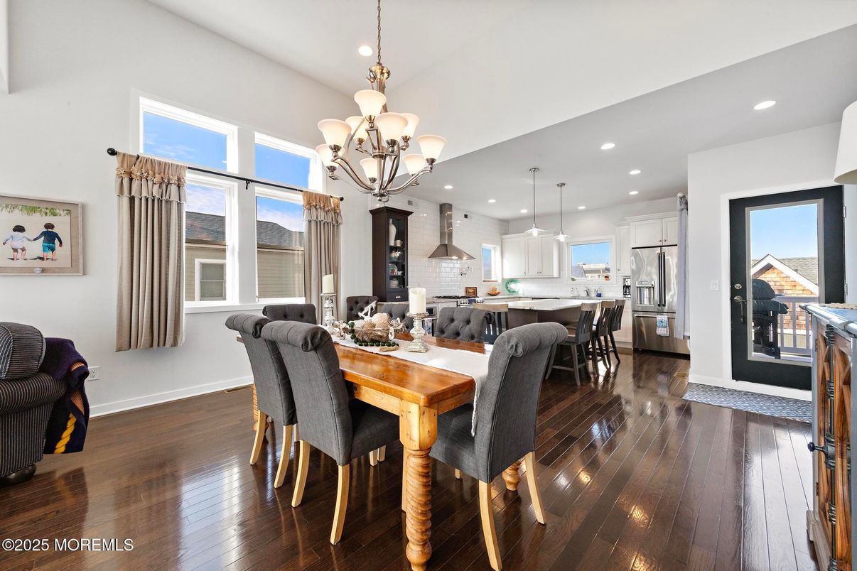 Chandelier, Dining room, Interior, Kitchen, Pendant Lights, Recessed Lighting, Stainless Steel Appliances, Wood Texture Flooring