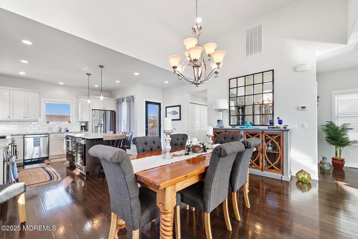Chandelier, Dining room, Interior, Kitchen, Pendant Lights, Recessed Lighting, Stainless Steel Appliances, Wood Texture Flooring
