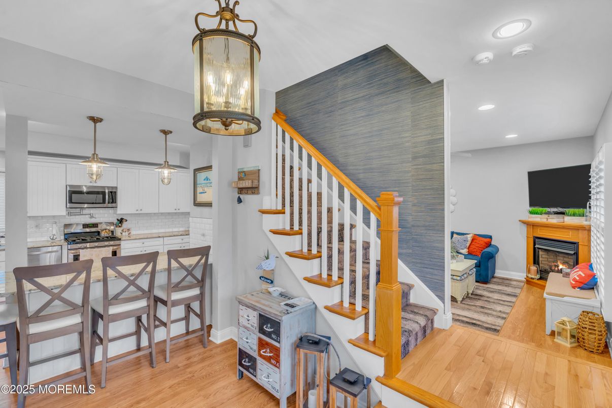 Dining room, Fireplace, Interior, Kitchen, Pendant Lights, Recessed Lighting, Wood Texture Flooring