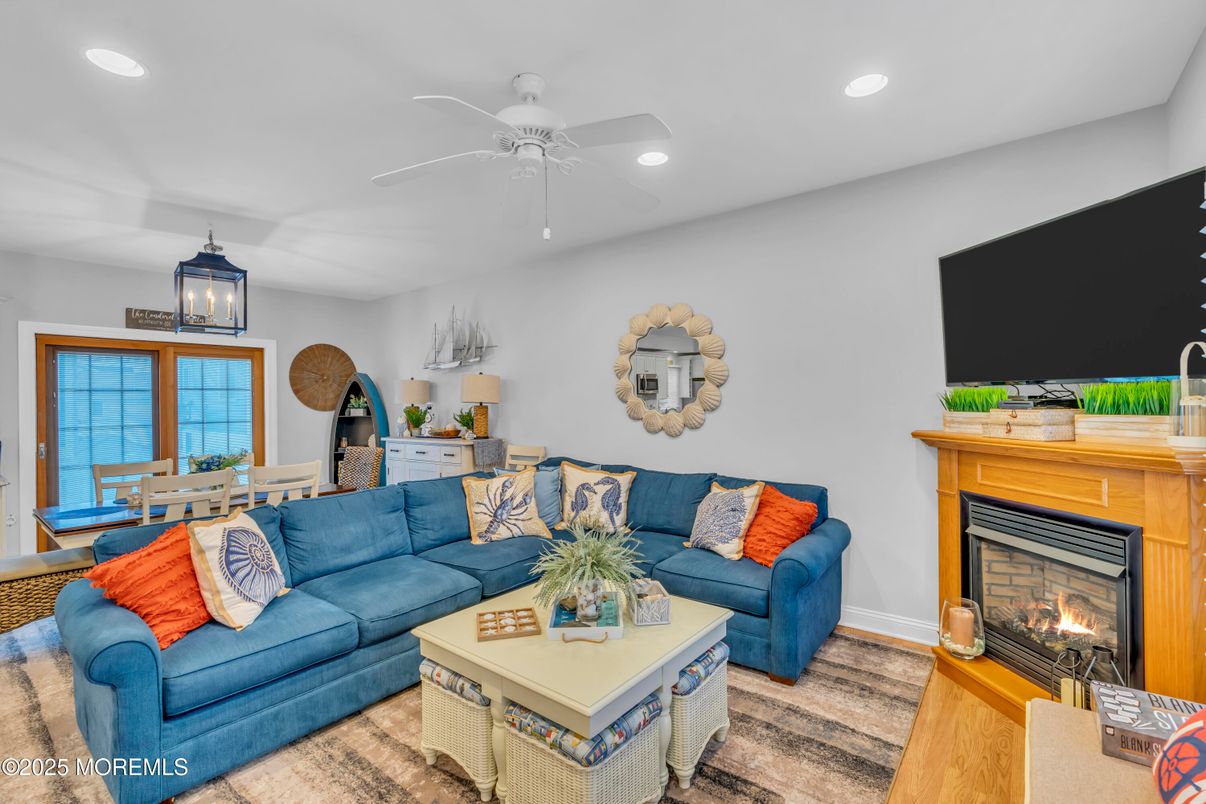 Dining room, Fireplace, Interior, Living room, Recessed Lighting, Wood Texture Flooring