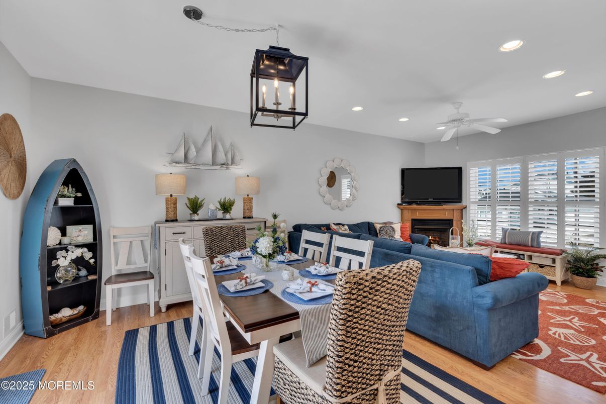 Dining room, Fireplace, Interior, Living room, Recessed Lighting, Wood Texture Flooring