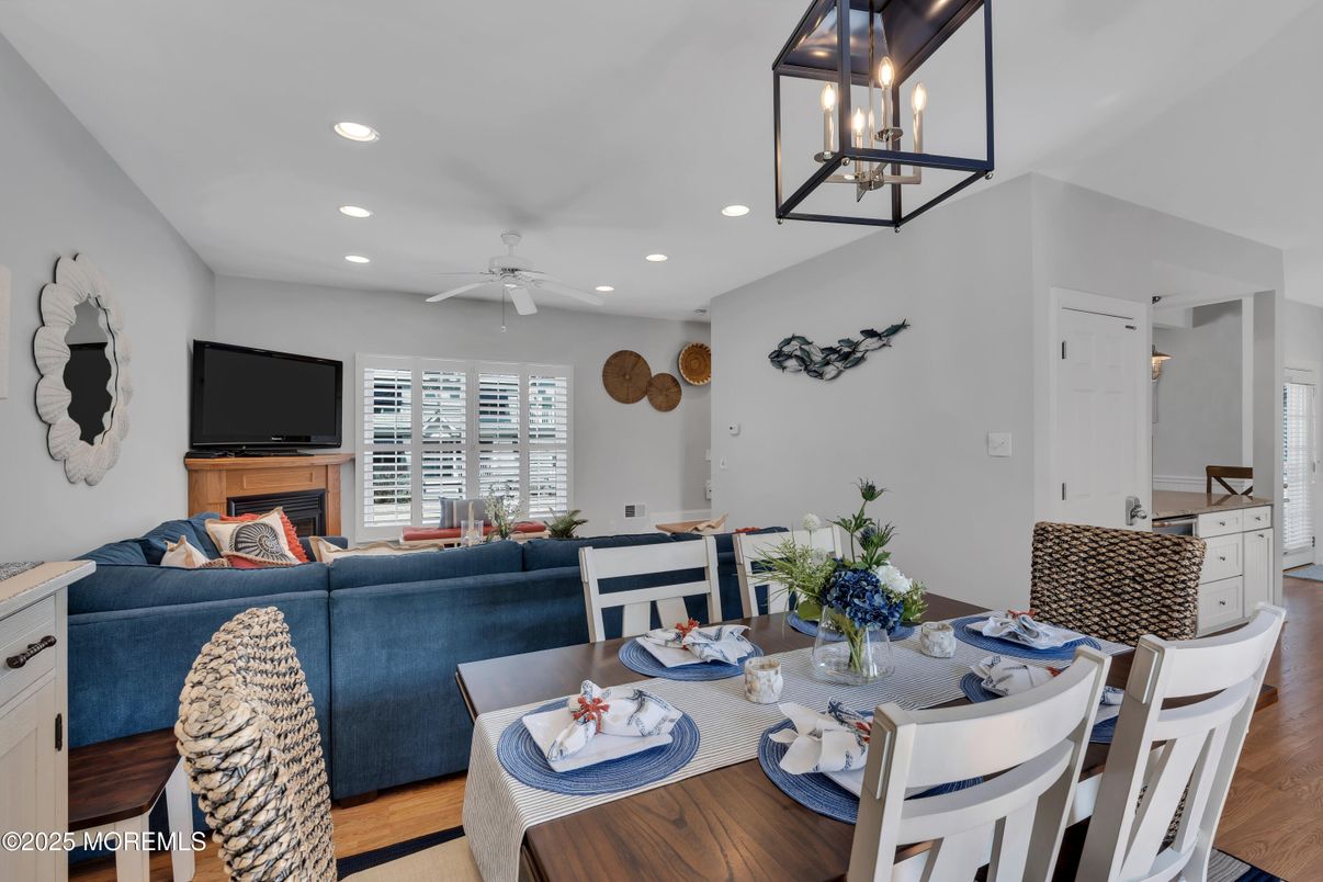 Dining room, Fireplace, Interior, Living room, Pendant Lights, Recessed Lighting, Wood Texture Flooring