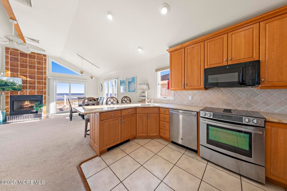 Dining room, Fireplace, Interior, Kitchen, Pendant Lights, Recessed Lighting, Stainless Steel Appliances