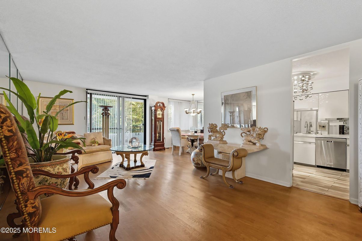 Chandelier, Dining room, Interior, Kitchen, Living room, Pendant Lights, Stainless Steel Appliances, Wood Texture Flooring