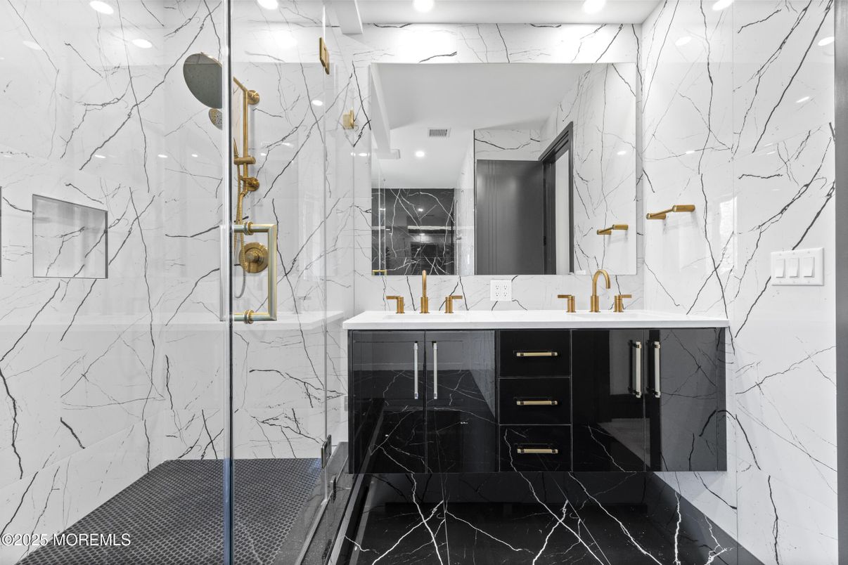 Bathroom, Dual Sink Vanities, Glass Shower, Interior, Marble, Marble Walls, Recessed Lighting