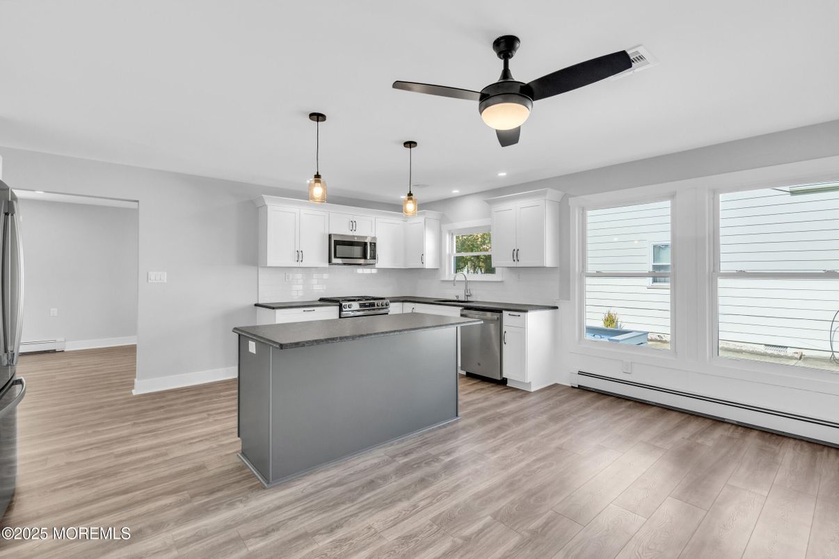 Interior, Kitchen, Pendant Lights, Recessed Lighting, Stainless Steel Appliances, Wood Texture Flooring