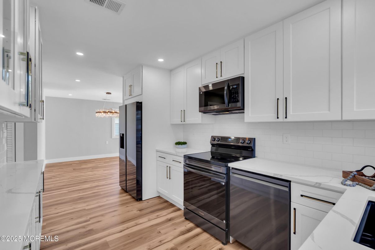 Chandelier, Interior, Kitchen, Pendant Lights, Recessed Lighting, Stainless Steel Appliances, Wood Texture Flooring