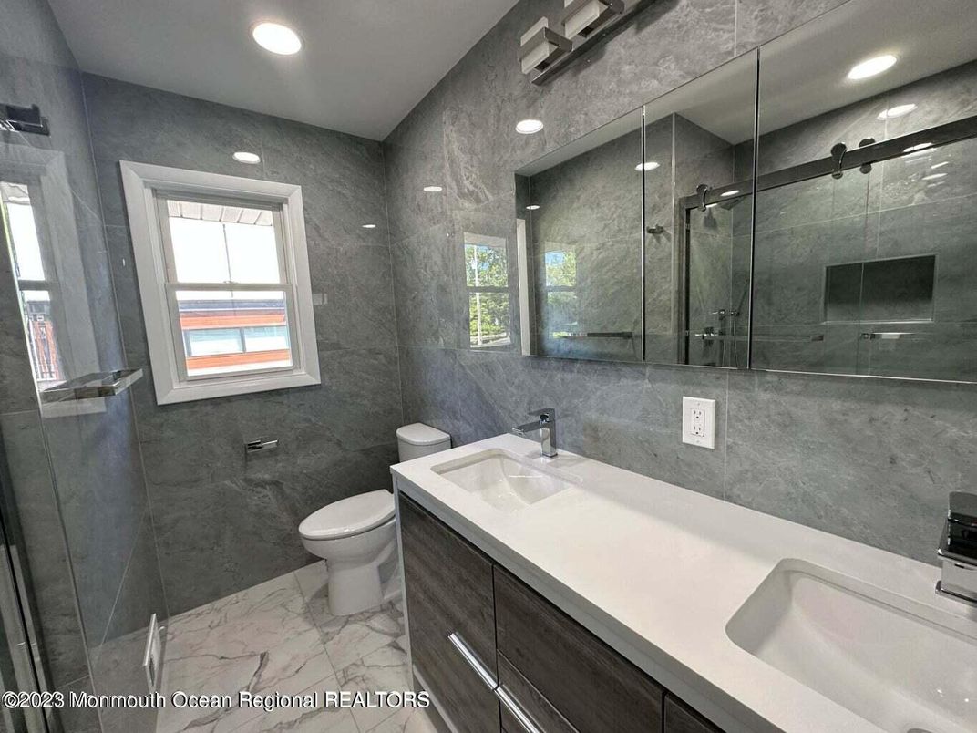 Bathroom, Dual Sink Vanities, Glass Shower, Interior, Marble, Recessed Lighting