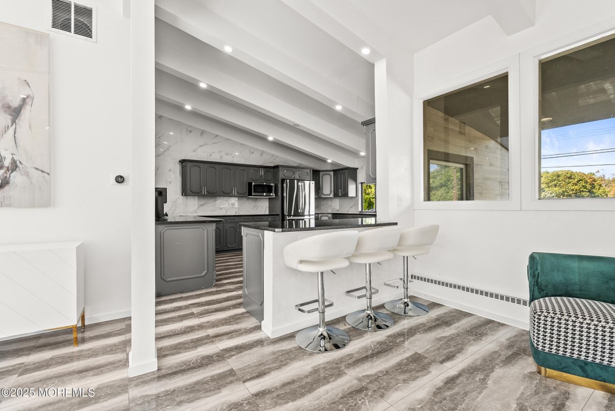 Interior, Kitchen, Marble Walls, Recessed Lighting, Stainless Steel Appliances