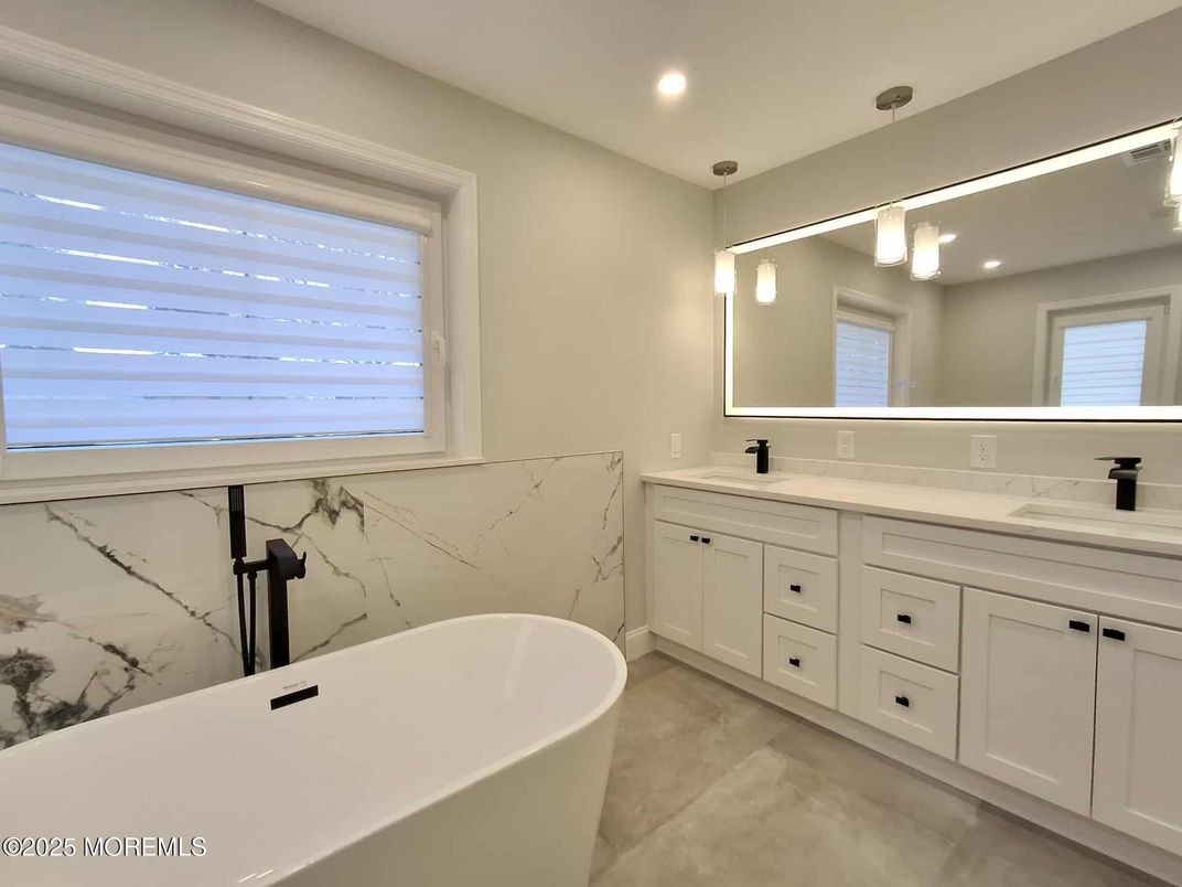 Bathroom, Dual Sink Vanities, Free Standing Baths, Interior, Marble Walls, Recessed Lighting