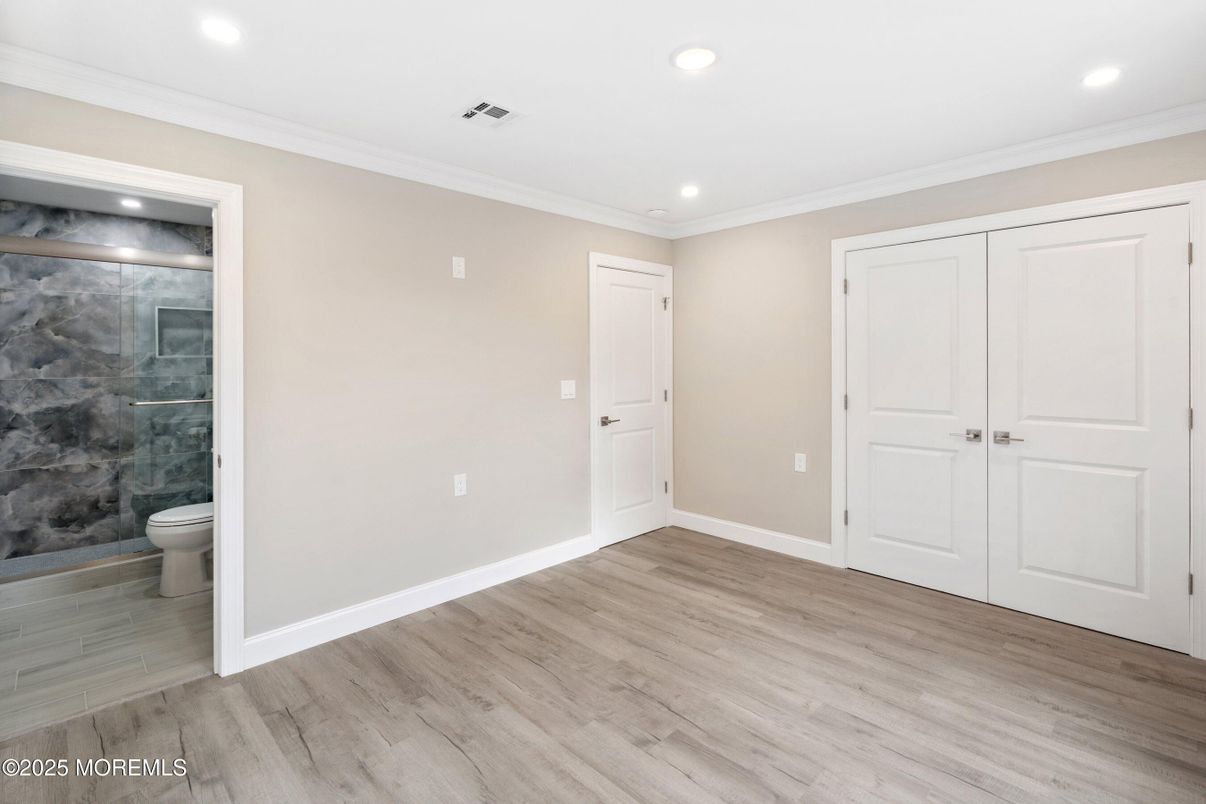 Bathroom, Empty room, Glass Shower, Interior, Recessed Lighting, Wood Texture Flooring