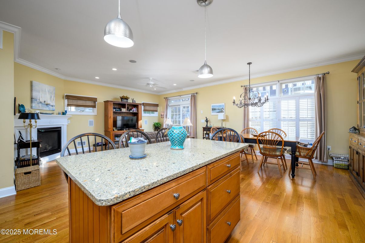Chandelier, Dining room, Fireplace, Interior, Pendant Lights, Recessed Lighting, Wood Texture Flooring