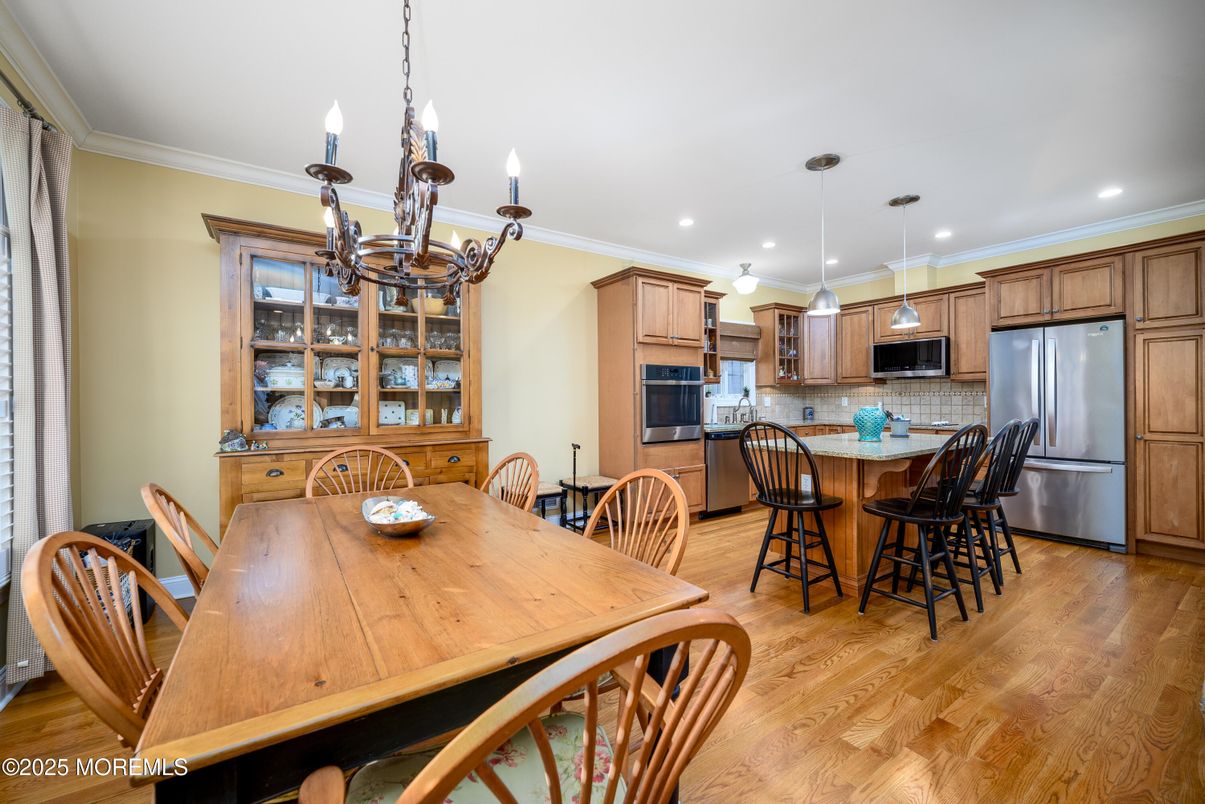 Chandelier, Dining room, Interior, Kitchen, Pendant Lights, Recessed Lighting, Stainless Steel Appliances, Wood Texture Flooring