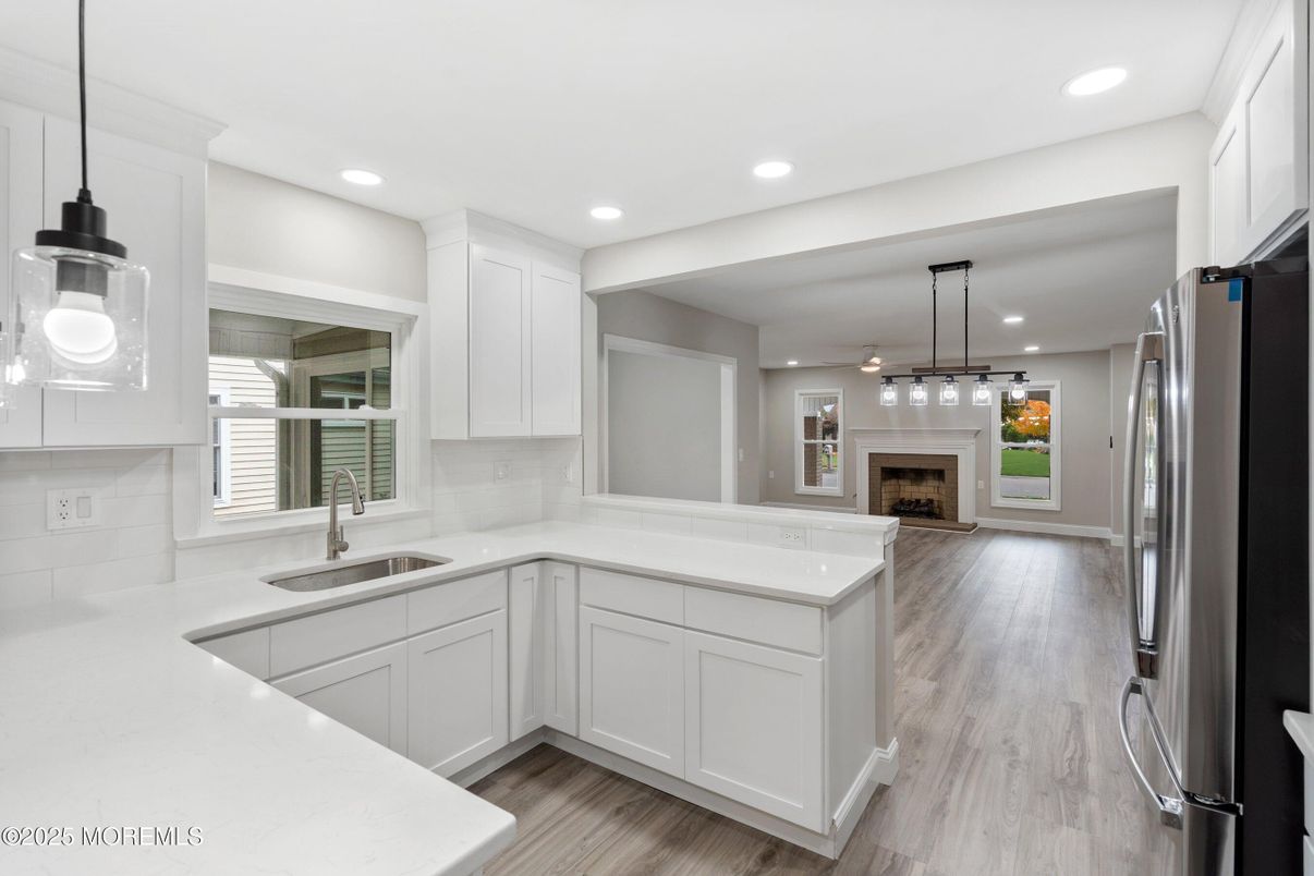 Fireplace, Interior, Kitchen, Pendant Lights, Recessed Lighting, Stainless Steel Appliances, Wood Texture Flooring